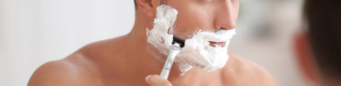 Man shaving face 