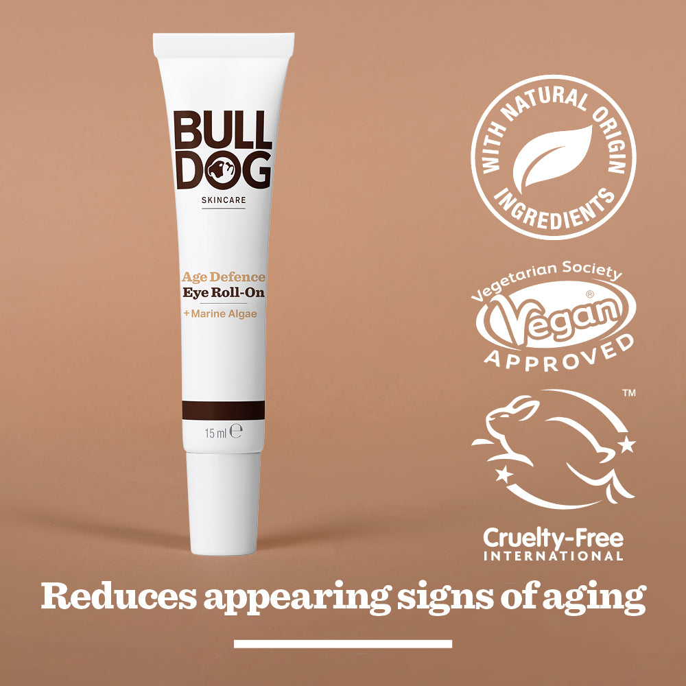 A box of the Age Defence Skincare Routine Bundle is displayed on a brown background, surrounded by icons showing natural ingredients, vegan approval, and cruelty-free certification—highlighting its antioxidant complex benefits.