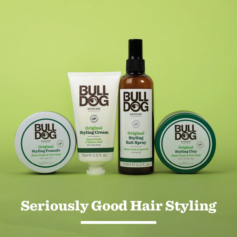 Bulldog Skincares Original Hair Styling Clay, featured on a green background with “Seriously Good Hair Styling” in white below, offers a matte finish and firm hold.