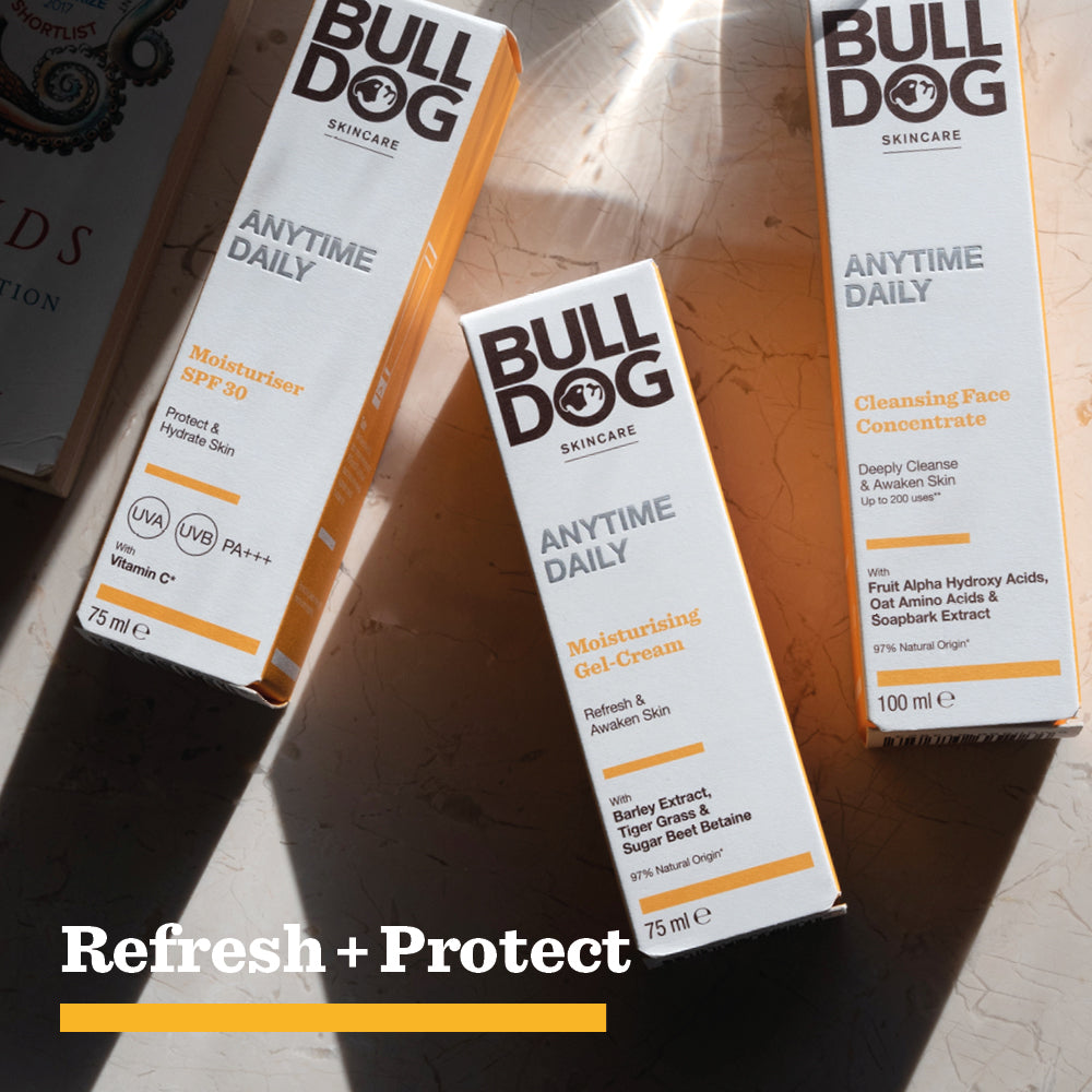 Three Bulldog Skincare products—Moisturiser SPF 30, Anytime Daily Moisturising Gel Cream, and Cleansing Face Concentrate—made with natural origin ingredients are arranged on a sunlit surface. Text reads, Refresh + Protect for ultimate skin hydration.